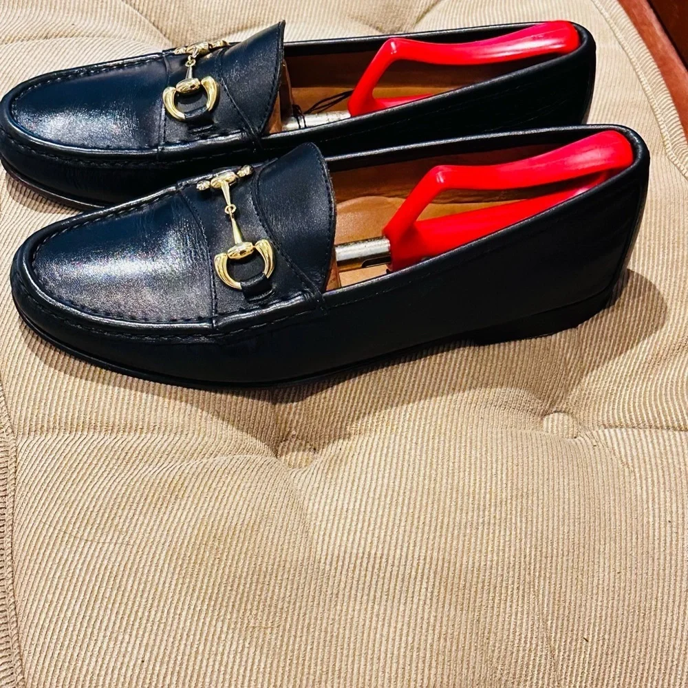 Jay Butler’s Horse Bit Black Leather Loafers with Gold Buckle.